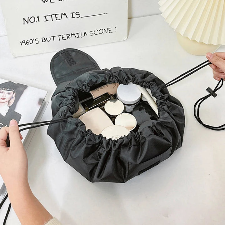 GlowFold drawstring cosmetic bag pulled closed for travel